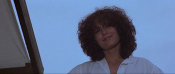 Movie still from “Mad Max” (1979), directed by George Miller – A person wearing a white shirt; Close Up shot, Low angle