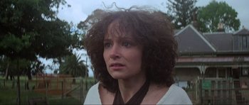 Movie still from “Mad Max” (1979), directed by George Miller – A person wearing a white shirt; Close Up shot, Low angle