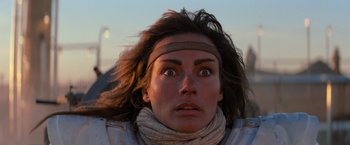 Movie still from “The Road Warrior” (1981), directed by George Miller – A person wearing a headband; Close Up shot, Low angle