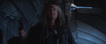 Movie still from “Mad Max Beyond Thunderdome” (1985), directed by George Miller – A person with long hair; Close Up shot, Low angle