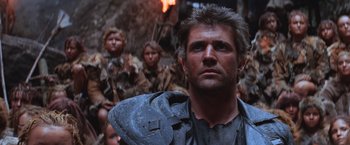 Movie still from “Mad Max Beyond Thunderdome” (1985), directed by George Miller – A group of young people dressed in costumes; Close Up shot, Low angle