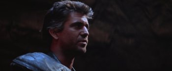 Movie still from “Mad Max Beyond Thunderdome” (1985), directed by George Miller – A person looking to his left; Close Up shot, Low angle