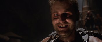 Movie still from “Mad Max Beyond Thunderdome” (1985), directed by George Miller – A person with a beard; Close Up shot, Low angle