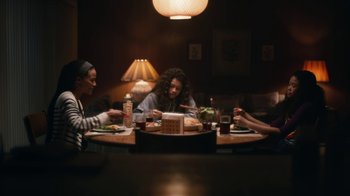 Movie still from “Euphoria” (2019), created by Sam Levinson – A group of people sitting at a table eating food; Wide shot, High angle