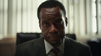 Movie still from “Euphoria” (2019), created by Sam Levinson – A person wearing a suit and tie; Close Up shot, Low angle