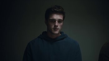 Movie still from “Euphoria” (2019), created by Sam Levinson – A young man in a black hoodie stares at the camera; Close Up shot, Low angle