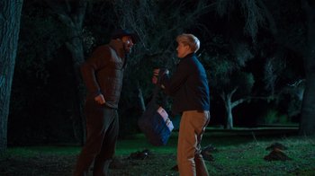 Movie still from “Mae Martin: SAP” (2023), directed by Abbi Jacobson – A man and a woman in the woods at night; Medium shot, Over the shoulder angle