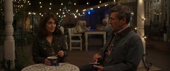 Movie still from “Maggie Moore(s)” (2023), directed by John Slattery – A man and a woman are sitting at a table; Medium shot, Over the shoulder angle