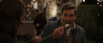 Movie still from “Maggie Moore(s)” (2023), directed by John Slattery – A person eating food from a spoon; Close Up shot, Over the shoulder angle