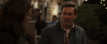 Movie still from “Maggie Moore(s)” (2023), directed by John Slattery – A person wearing a jacket; Close Up shot, Over the shoulder angle