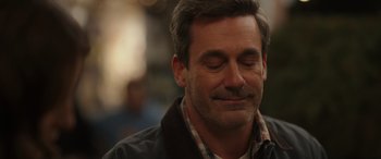 Movie still from “Maggie Moore(s)” (2023), directed by John Slattery – A person with his eyes closed; Close Up shot, Over the shoulder angle