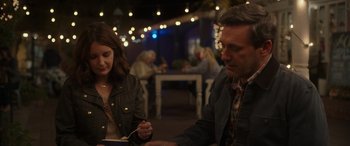 Movie still from “Maggie Moore(s)” (2023), directed by John Slattery – A man and a woman sitting at a table in a restaurant; Medium shot, Over the shoulder angle