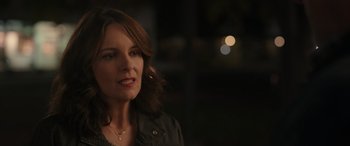 Movie still from “Maggie Moore(s)” (2023), directed by John Slattery – A person wearing a black jacket; Close Up shot, Over the shoulder angle