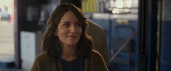 Movie still from “Maggie Moore(s)” (2023), directed by John Slattery – A person wearing a sweater; Close Up shot, Over the shoulder angle