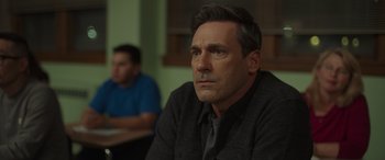 Movie still from “Maggie Moore(s)” (2023), directed by John Slattery – A person sitting in front of another person; Close Up shot, Over the shoulder angle