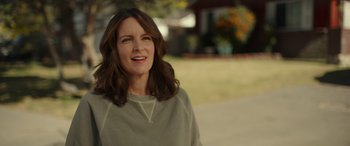 Movie still from “Maggie Moore(s)” (2023), directed by John Slattery – A person wearing a sweater; Close Up shot, Over the shoulder angle