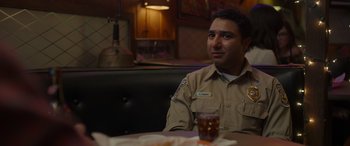 Movie still from “Maggie Moore(s)” (2023), directed by John Slattery – A man sitting at a table in a restaurant; Close Up shot, Over the shoulder angle