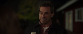 Movie still from “Maggie Moore(s)” (2023), directed by John Slattery – A person wearing a jacket; Close Up shot, Over the shoulder angle