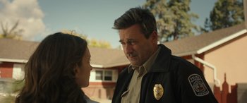 Movie still from “Maggie Moore(s)” (2023), directed by John Slattery – A man and a woman talking to each other outside; Close Up shot, Over the shoulder angle