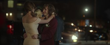 Movie still from “Maggie Moore(s)” (2023), directed by John Slattery – A man and a woman dancing together at a prom; Medium shot, Over the shoulder angle