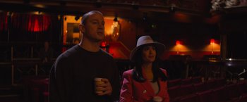Movie still from “Magic Mike's Last Dance” (2023), directed by Steven Soderbergh – A man and a woman standing next to each other; Medium shot, Over the shoulder angle