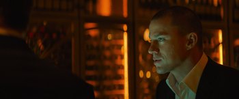 Movie still from “Magic Mike's Last Dance” (2023), directed by Steven Soderbergh – A person in a room with lights; Close Up shot, Low angle