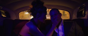 Movie still from “Magic Mike's Last Dance” (2023), directed by Steven Soderbergh – A man and a woman in the back of a car; Close Up shot, Over the shoulder angle