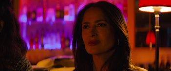 Movie still from “Magic Mike's Last Dance” (2023), directed by Steven Soderbergh – A woman's face at a party; Close Up shot, Over the shoulder angle