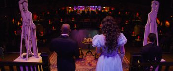 Movie still from “Magic Mike's Last Dance” (2023), directed by Steven Soderbergh – A man and a woman standing in front of an audience; Wide shot, Over the shoulder angle