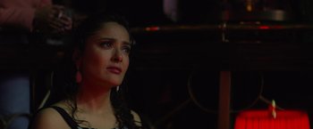 Movie still from “Magic Mike's Last Dance” (2023), directed by Steven Soderbergh – A person looking at something in the dark; Close Up shot, Over the shoulder angle