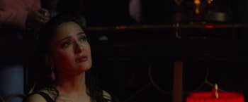 Movie still from “Magic Mike's Last Dance” (2023), directed by Steven Soderbergh – A person sitting in front of a mirror; Close Up shot, Over the shoulder angle