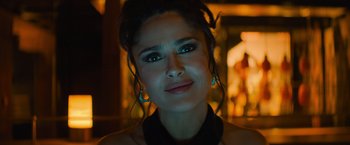 Movie still from “Magic Mike's Last Dance” (2023), directed by Steven Soderbergh – A person wearing a black shirt; Close Up shot, Over the shoulder angle