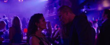 Movie still from “Magic Mike's Last Dance” (2023), directed by Steven Soderbergh – A man and a woman are talking in a nightclub; Close Up shot, Low angle