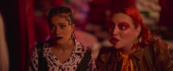 Movie still from “Making It Up” (2023), directed by Guillermo Calderón – Two women are standing next to each other; Close Up shot, Over the shoulder angle