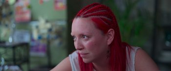 Movie still from “Making It Up” (2023), directed by Guillermo Calderón – A person with long red hair; Close Up shot, High angle