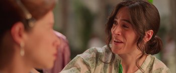 Movie still from “Making It Up” (2023), directed by Guillermo Calderón – A person sitting in front of another person; Close Up shot, Over the shoulder angle