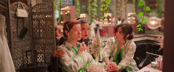 Movie still from “Making It Up” (2023), directed by Guillermo Calderón – A group of women sitting next to each other in a room; Medium shot, Over the shoulder angle