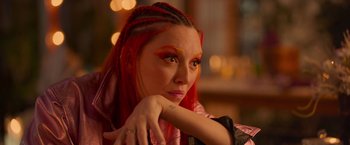 Movie still from “Making It Up” (2023), directed by Guillermo Calderón – A person with long red hair; Close Up shot, Over the shoulder angle