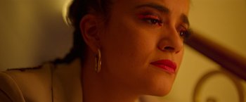 Movie still from “Making It Up” (2023), directed by Guillermo Calderón – A person wearing a red lipstick; Close Up shot, High angle