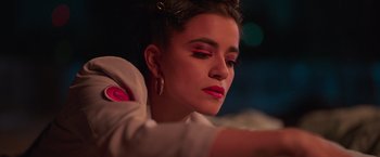 Movie still from “Making It Up” (2023), directed by Guillermo Calderón – A person wearing a white shirt; Close Up shot, Low angle