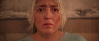 Movie still from “Making It Up” (2023), directed by Guillermo Calderón – A person's face looking sad; Close Up shot, High angle