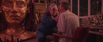 Movie still from “Making It Up” (2023), directed by Guillermo Calderón – An older man and woman sitting at a dinner table; Medium shot, Over the shoulder angle
