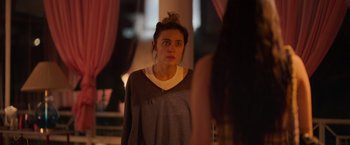 Movie still from “Making It Up” (2023), directed by Guillermo Calderón – A woman standing in front of a bathroom mirror; Close Up shot, Over the shoulder angle