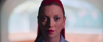 Movie still from “Making It Up” (2023), directed by Guillermo Calderón – A person with red hair; Close Up shot, Low angle