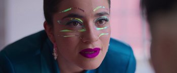 Movie still from “Making It Up” (2023), directed by Guillermo Calderón – A person with makeup on their face; Close Up shot, Low angle