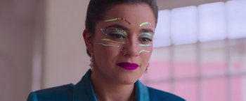 Movie still from “Making It Up” (2023), directed by Guillermo Calderón – A person with makeup on their face; Close Up shot, Low angle