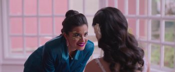 Movie still from “Making It Up” (2023), directed by Guillermo Calderón – A woman in a blue shirt is talking to another woman; Close Up shot, Over the shoulder angle