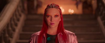 Movie still from “Making It Up” (2023), directed by Guillermo Calderón – A woman with red hair is looking at the camera; Close Up shot, Low angle