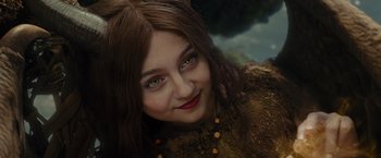 Movie still from “Maleficent” (2014), directed by Robert Stromberg – A woman's face with green eyes; Close Up shot, Low angle