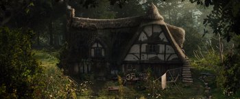 Movie still from “Maleficent” (2014), directed by Robert Stromberg – An image of an old house in the middle of the woods; Extreme Wide shot, Low angle